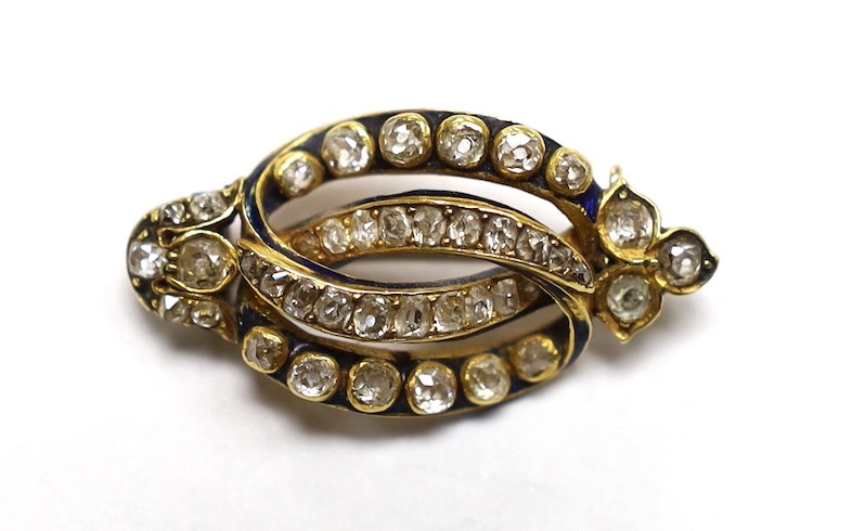 A late Victorian diamond set gold scroll brooch, 3.25cm, gross 5.8 grams